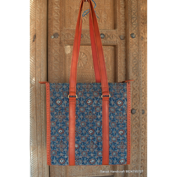 Leather handbag with block print fabric